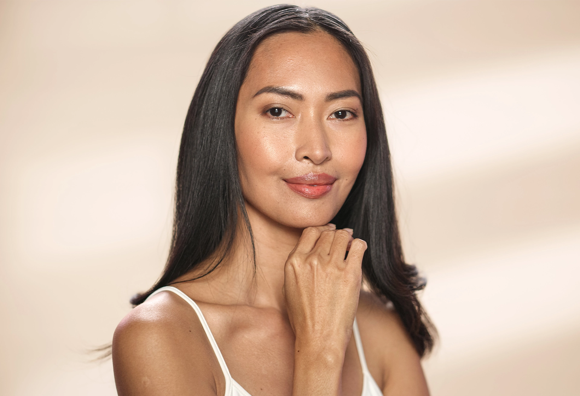 Woman with her hand on her chin