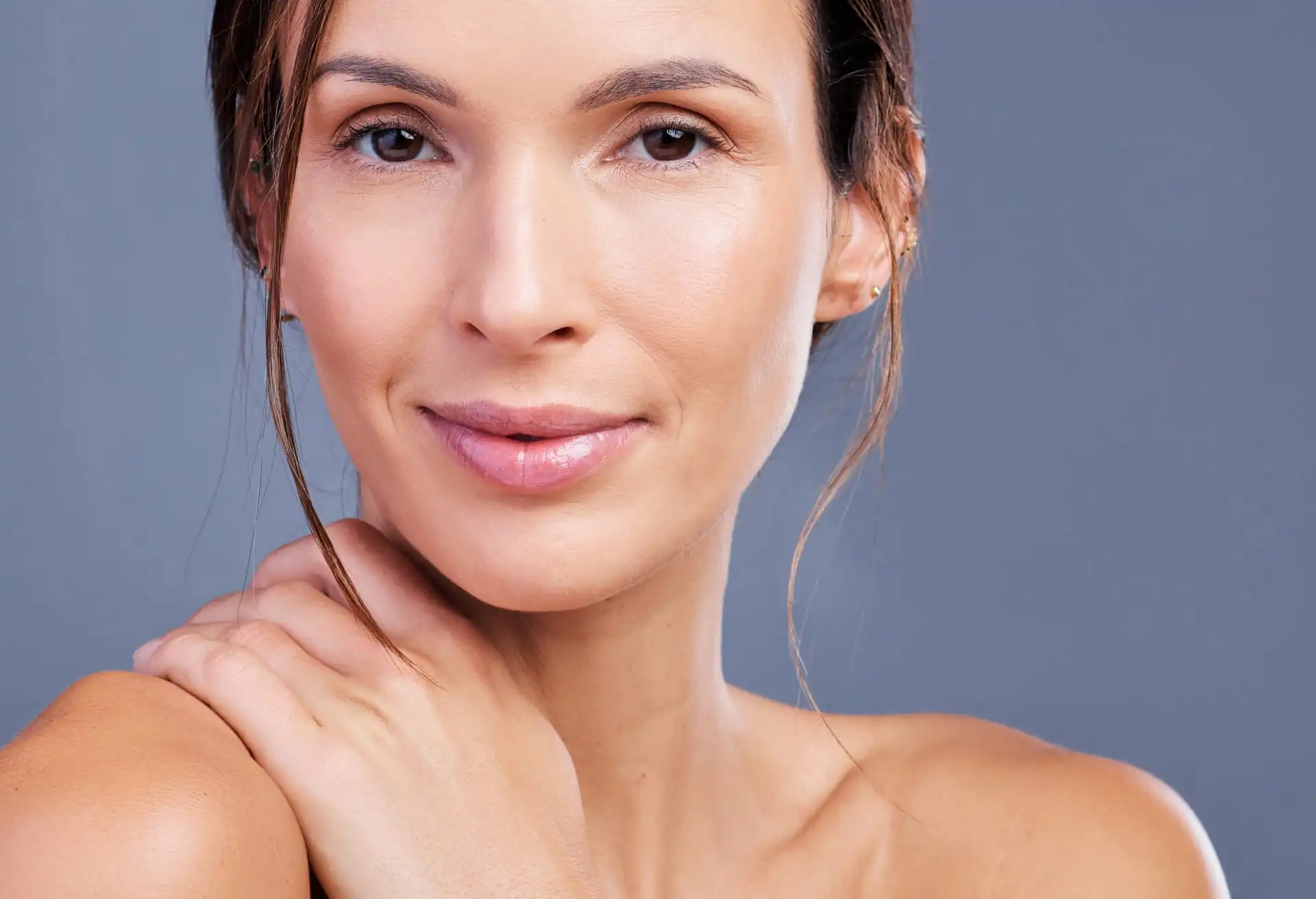 Woman with her hand on her neck