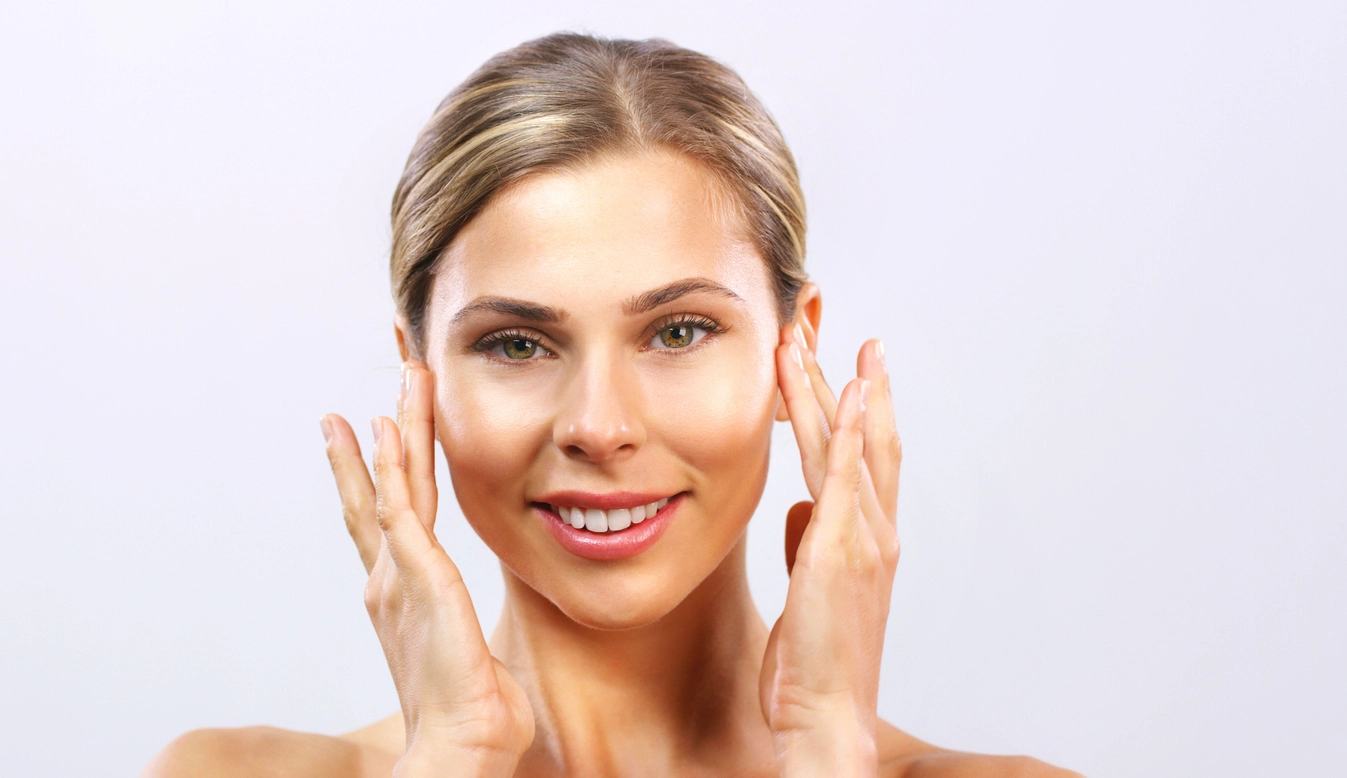 Beautiful woman touching her face.
